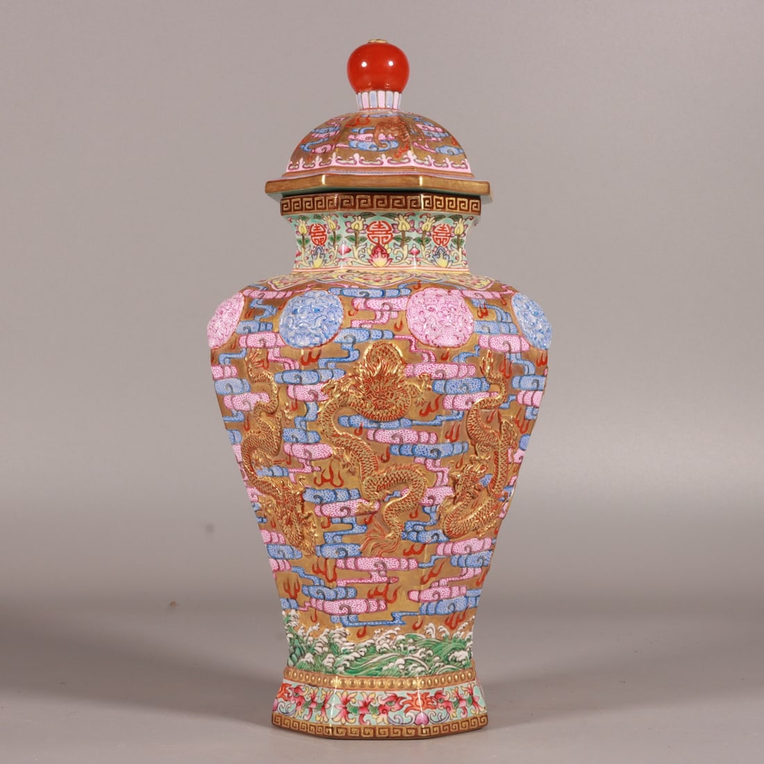A Qing Dynasty enamel carved gold ground dragon pattern hexagonal lion ear jar: Qing Dynasty enamel carved gold ground dragon pattern hexagonal lion ear jar Size:H:24cm Belly diameter:13cm (The Dimensions Of All Batches Are Manually Measured.If You Need More Detailed