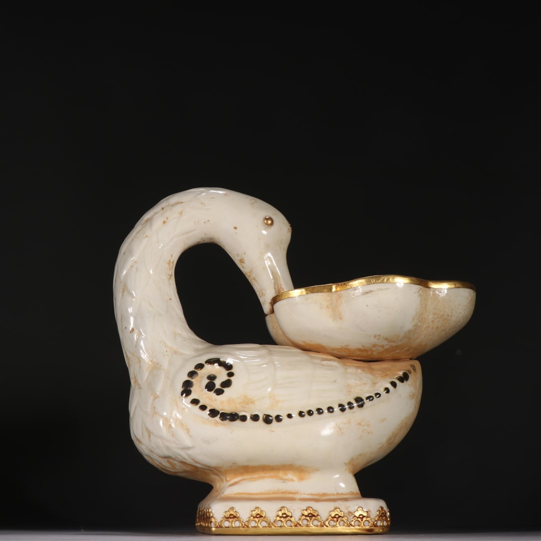 A gold-clad duck-shaped ornament of the Song Dynasty Ding kiln: The gold-clad duck-shaped ornament of the Song Dynasty Ding kiln Size:H:21.3cm W:22.3cm (The Dimensions Of All Batches Are Manually Measured.If You Need More Detailed Information, Please Contact Our C
