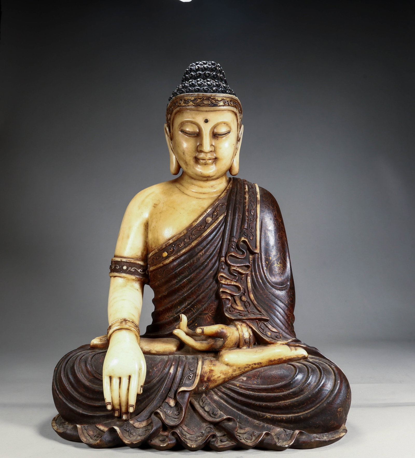 A white jade Shakyamuni Buddha from the Qing Dynasty: The white jade Shakyamuni Buddha of the Qing Dynasty Size: H:48cm L: 36cm W:22cm (The Dimensions Of All Batches Are Manually Measured.If You Need More Detailed Information, Please Contact Our
