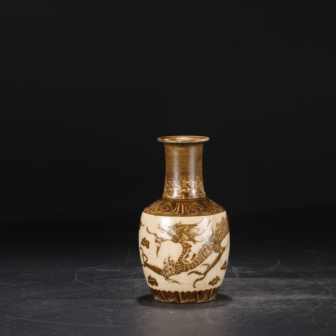 A brown color carved cloud dragon pattern string pattern bottle from the Song Dynasty Ding kiln (1 of 7)