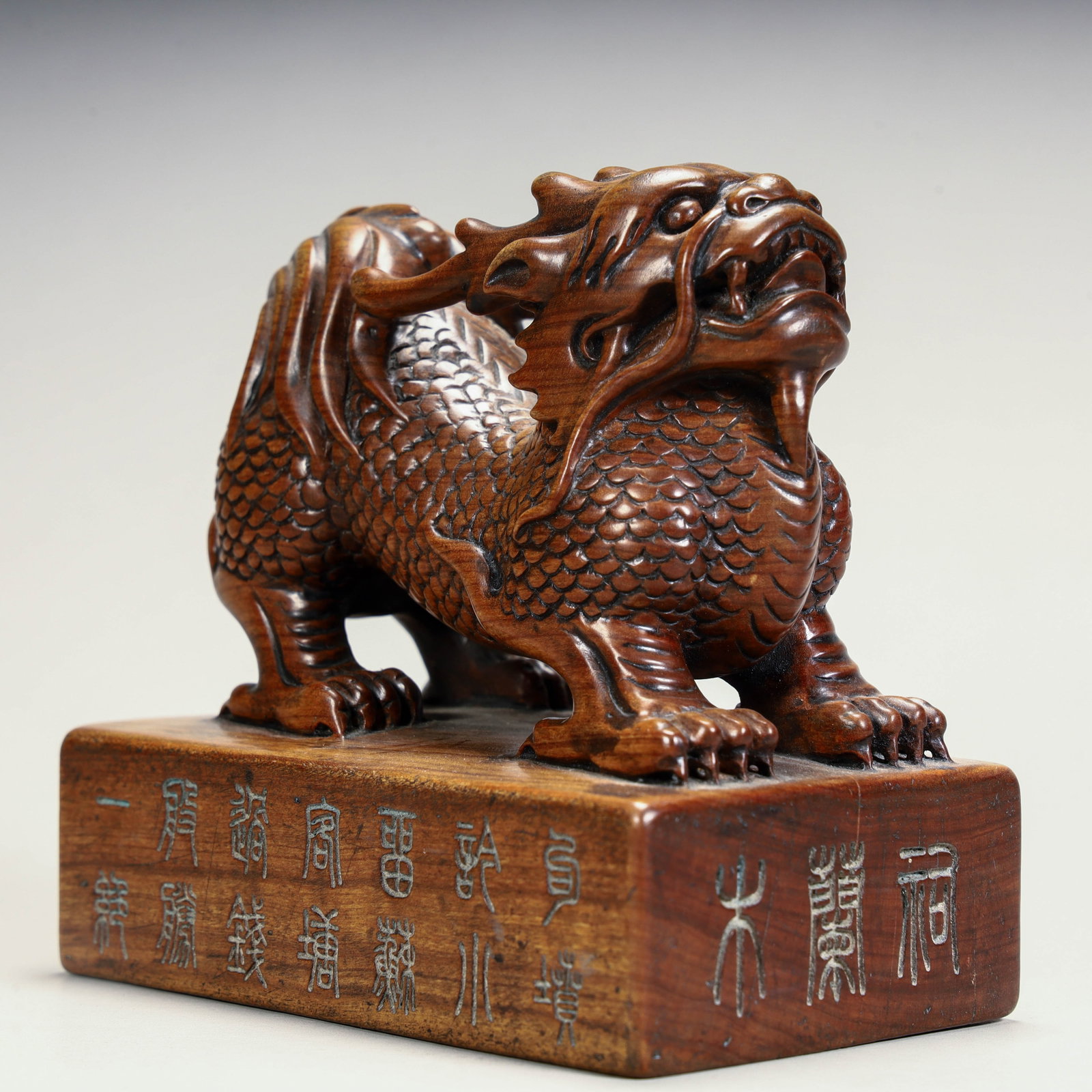 A Qing Dynasty boxwood carved unicorn button seal: Qing Dynasty boxwood carving unicorn button seal Size: H:10cm L: 10.5cm W:6.5cm W:363g (The Dimensions Of All Batches Are Manually Measured.If You Need More Detailed Information, Please Contact Our