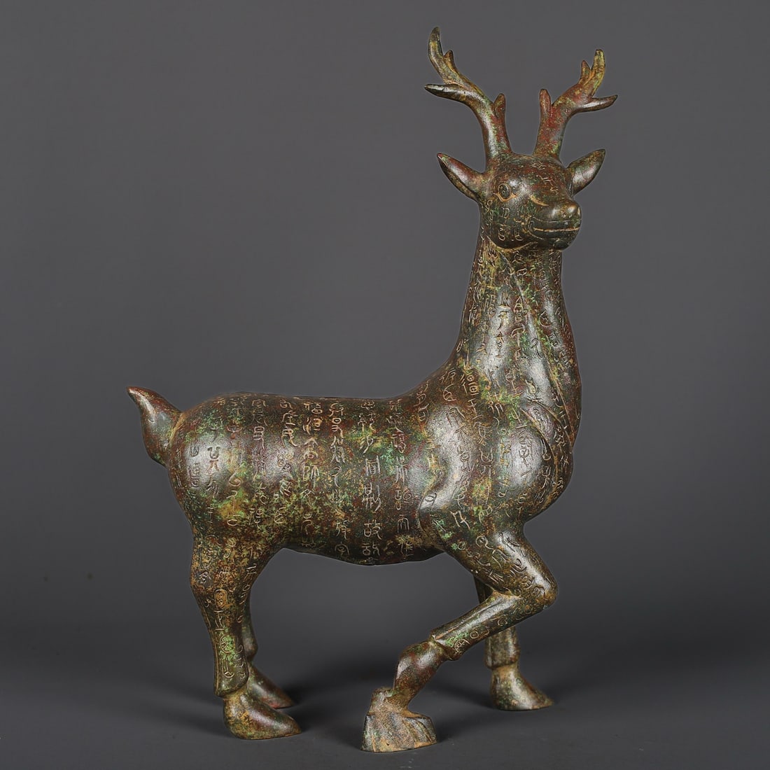 A bronze inscription of the Han Dynasty deer statue: Han Dynasty bronze inscription Lu Zun Size:L:27cm H:39cm W:2.08kg (The Dimensions Of All Batches Are Manually Measured.If You Need More Detailed Information, Please Contact Our Customer Service