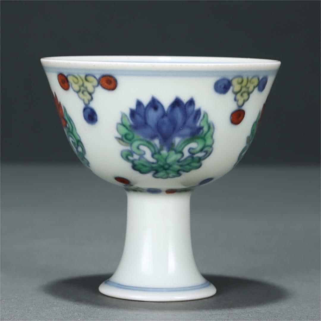 A Doucai lotus-patterned goblet made in the Chenghua year of the Ming Dynasty: Ming Dynasty Chenghua year system Doucai tuan lotus pattern goblet Size:H:6.9cm Belly diameter:7cm (The Dimensions Of All Batches Are Manually Measured.If You Need More Detailed Information, Please Co