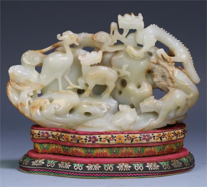 A Qing Dynasty Hetian jade seed material carving four elephant dragon pattern mountain ornament (1 of 9)