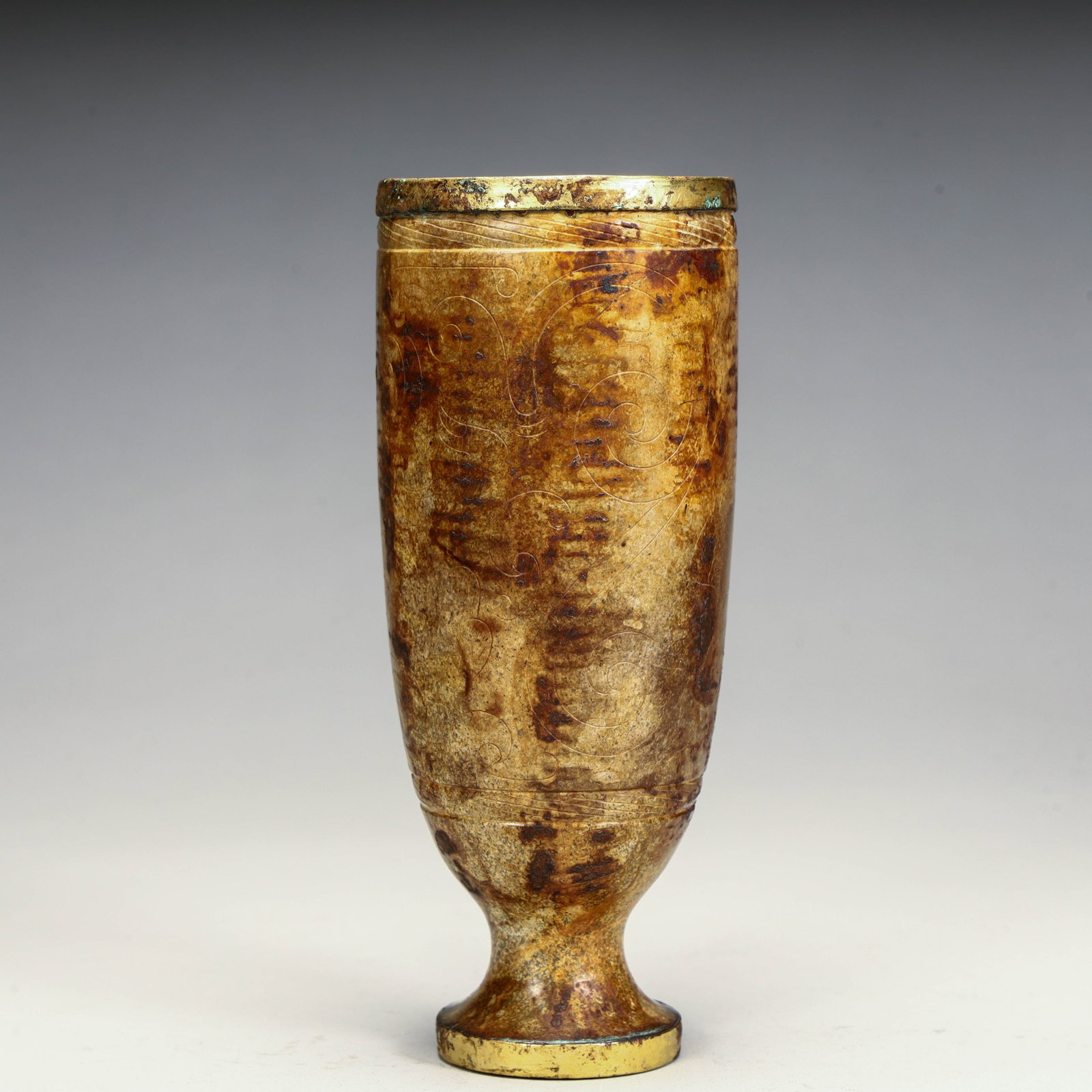A Qing Dynasty Lilong-patterned foot jade cup: Qing Dynasty Lilong pattern foot jade cup Size: H:12cm L: 5cm W:5cm W:193g (The Dimensions Of All Batches Are Manually Measured.If You Need More Detailed Information, Please Contact Our Customer Servi