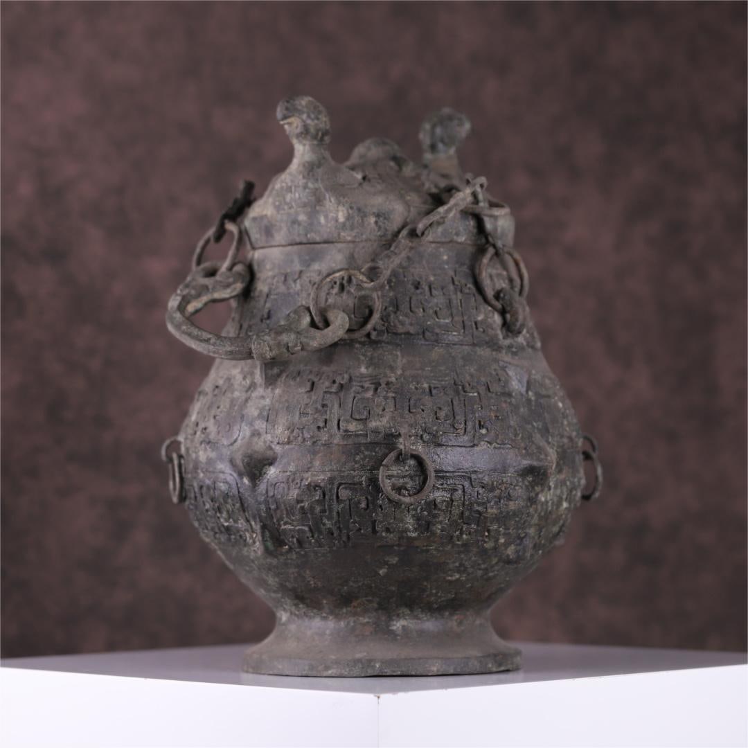 A bronze double phoenix ring from the Warring States period: The bronze double phoenix in the Warring States period lifts the beam Size:H:36x24cm W:5.285kg (The Dimensions Of All Batches Are Manually Measured.If You Need More Detailed Information, Please