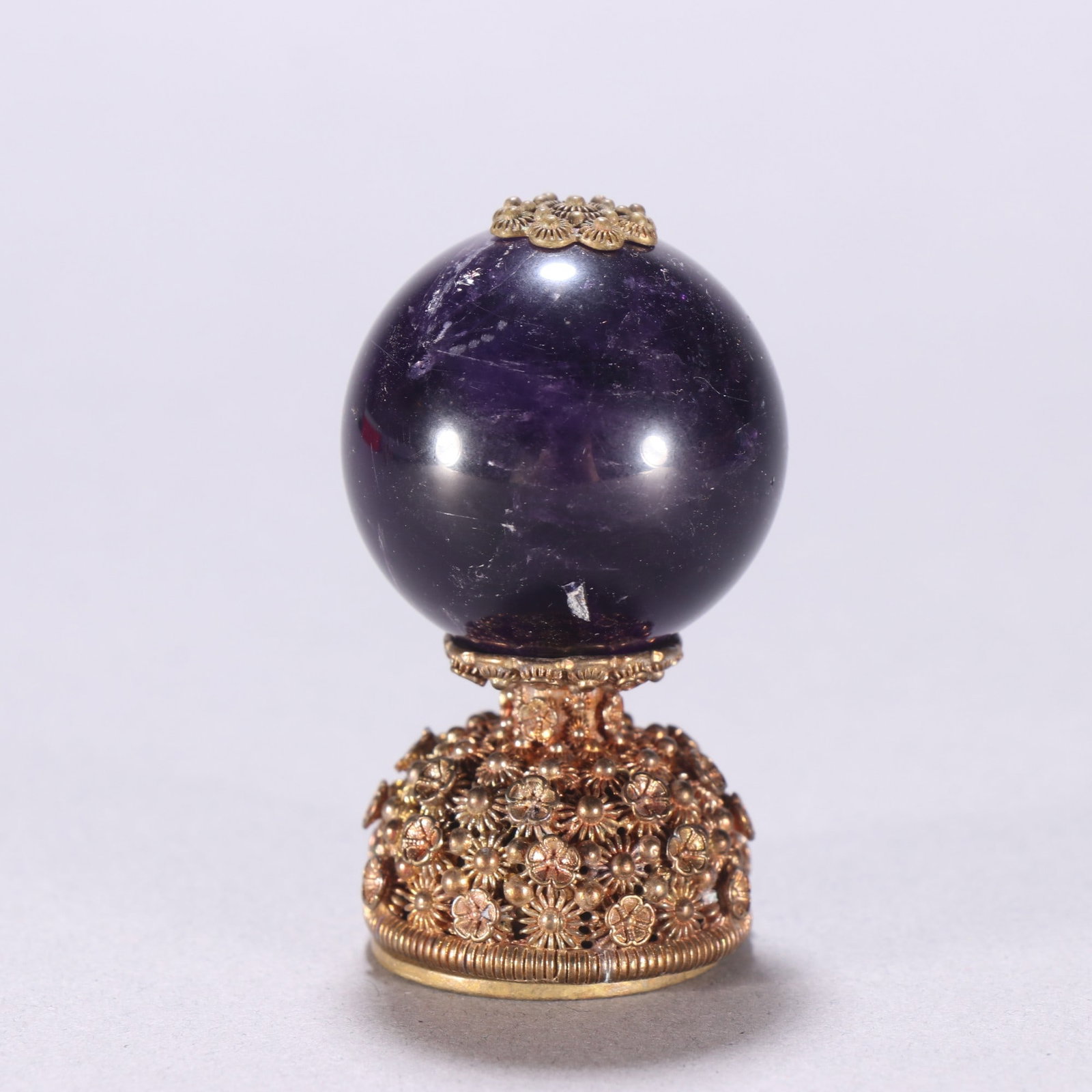 A Qing Dynasty copper gilt inlaid amethyst hat top (1 of 9)