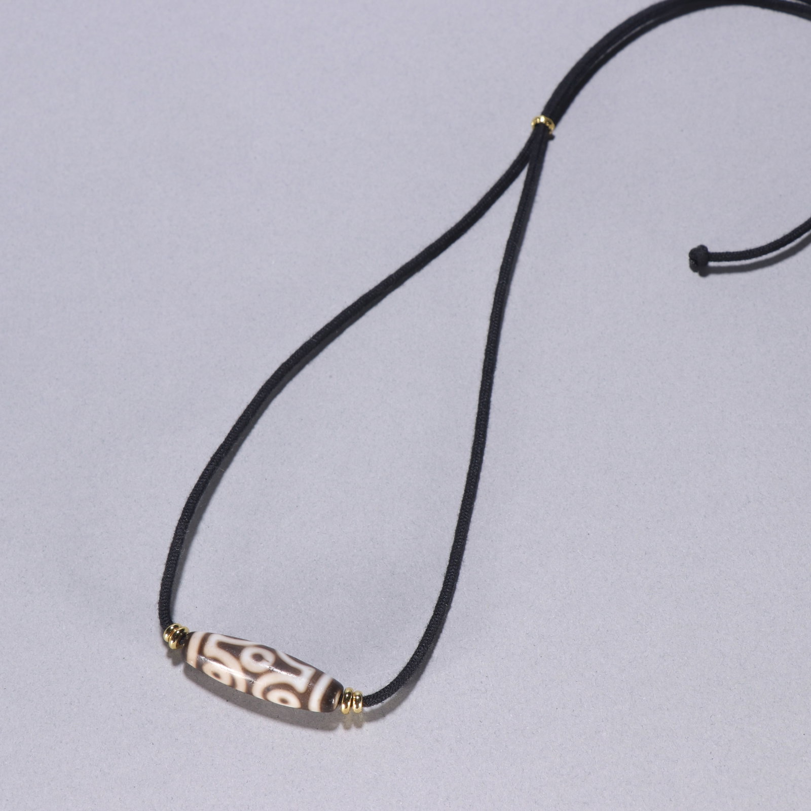A Qing Dynasty Vase Dzi Bead Pendant (1 of 9)