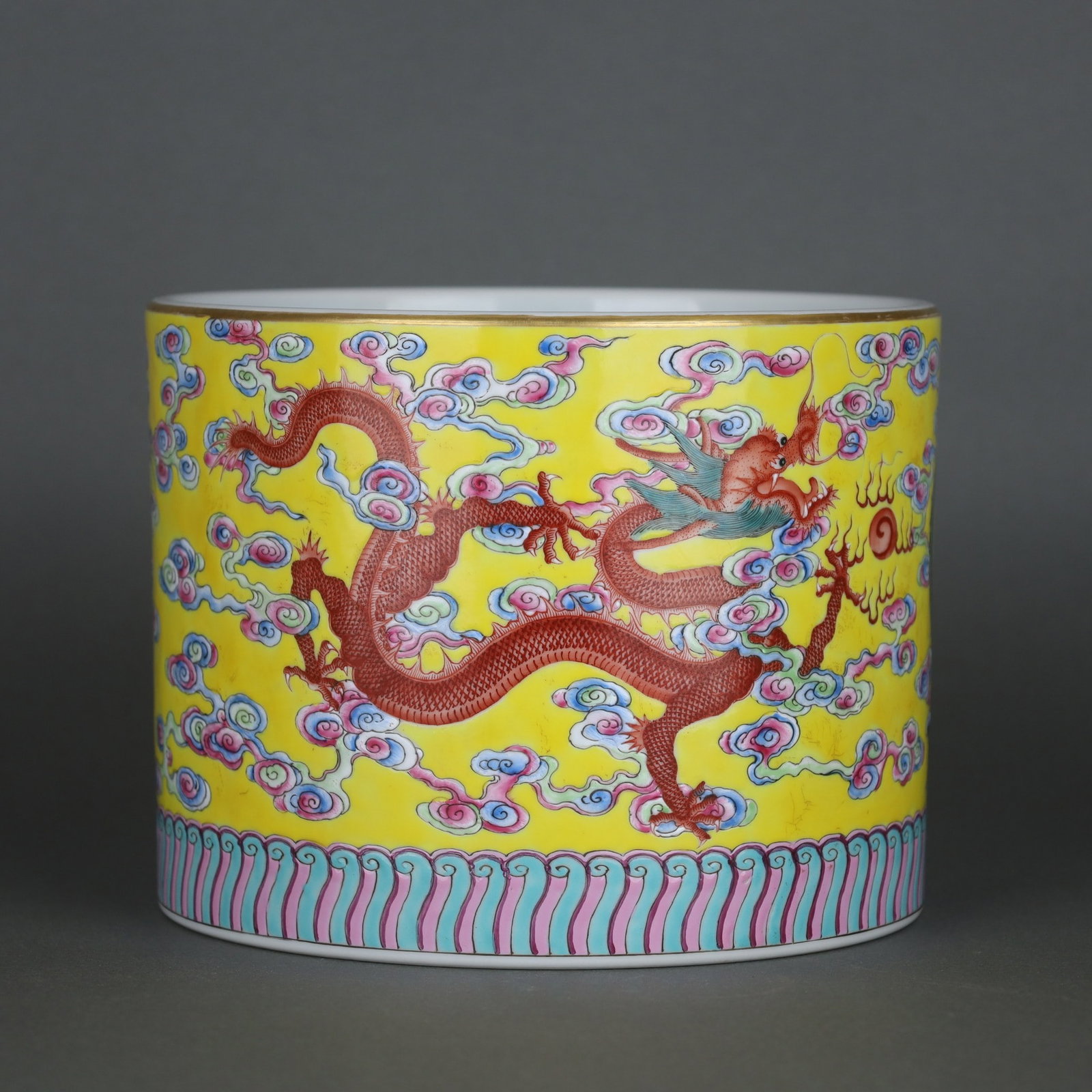 A brush pot with a yellow ground famille rose cloud and dragon motif, made during the Yongzheng (1 of 9)