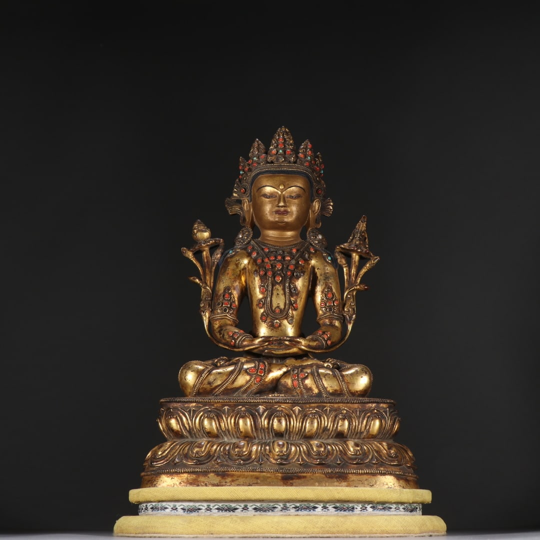 A finely crafted gilt bronze statue of the Longevity Buddha (1 of 9)