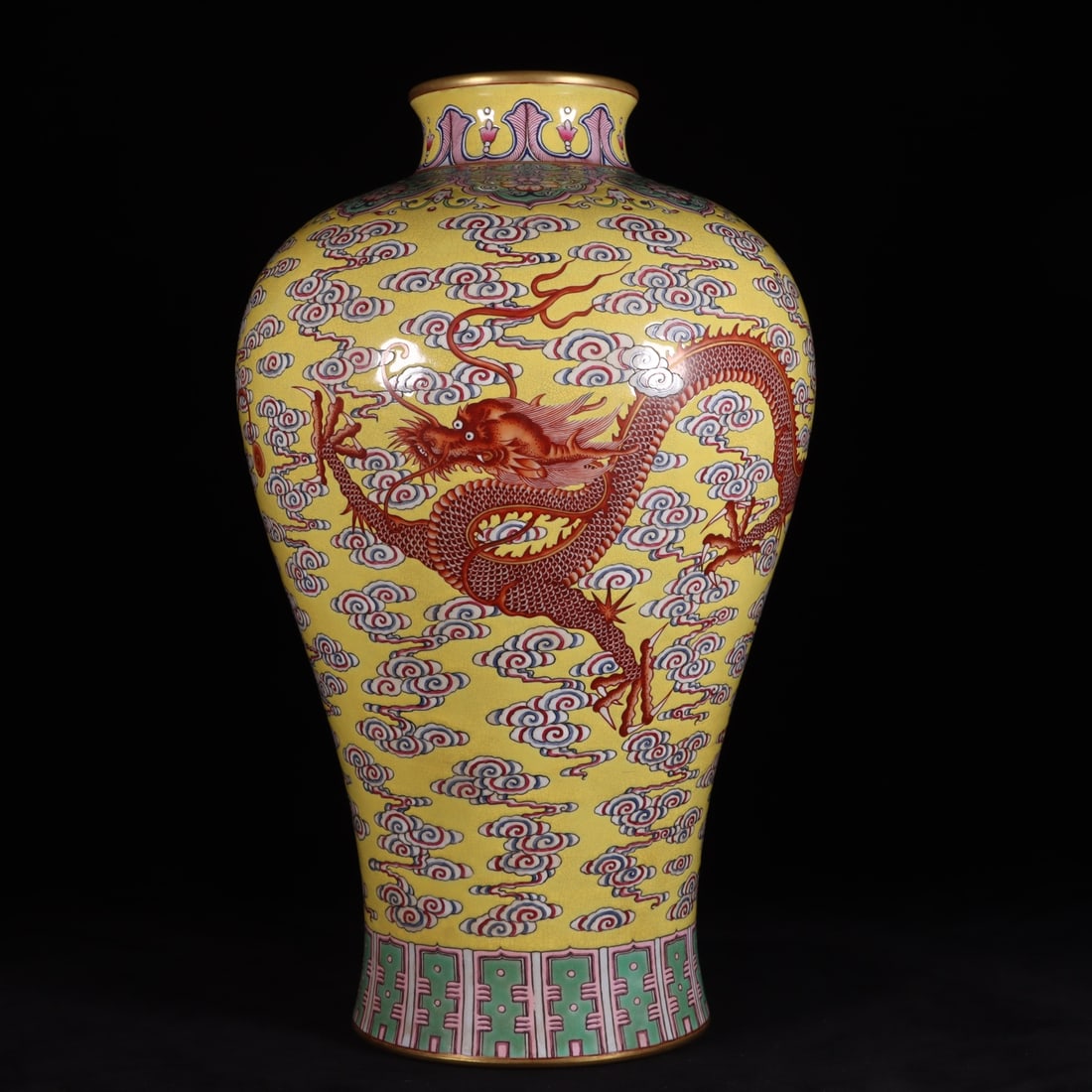 A yellow ground famille rose auspicious cloud and Azure Dragon Teaching Children's plum vase made: A yellow-ground famille rose auspicious cloud and Azure Dragon Teaching Children's plum vase made during the Qianlong period of the Qing Dynasty Size: H: 38cm Calibre: 9cm W: 22cm foot: 14.3cm Size: H