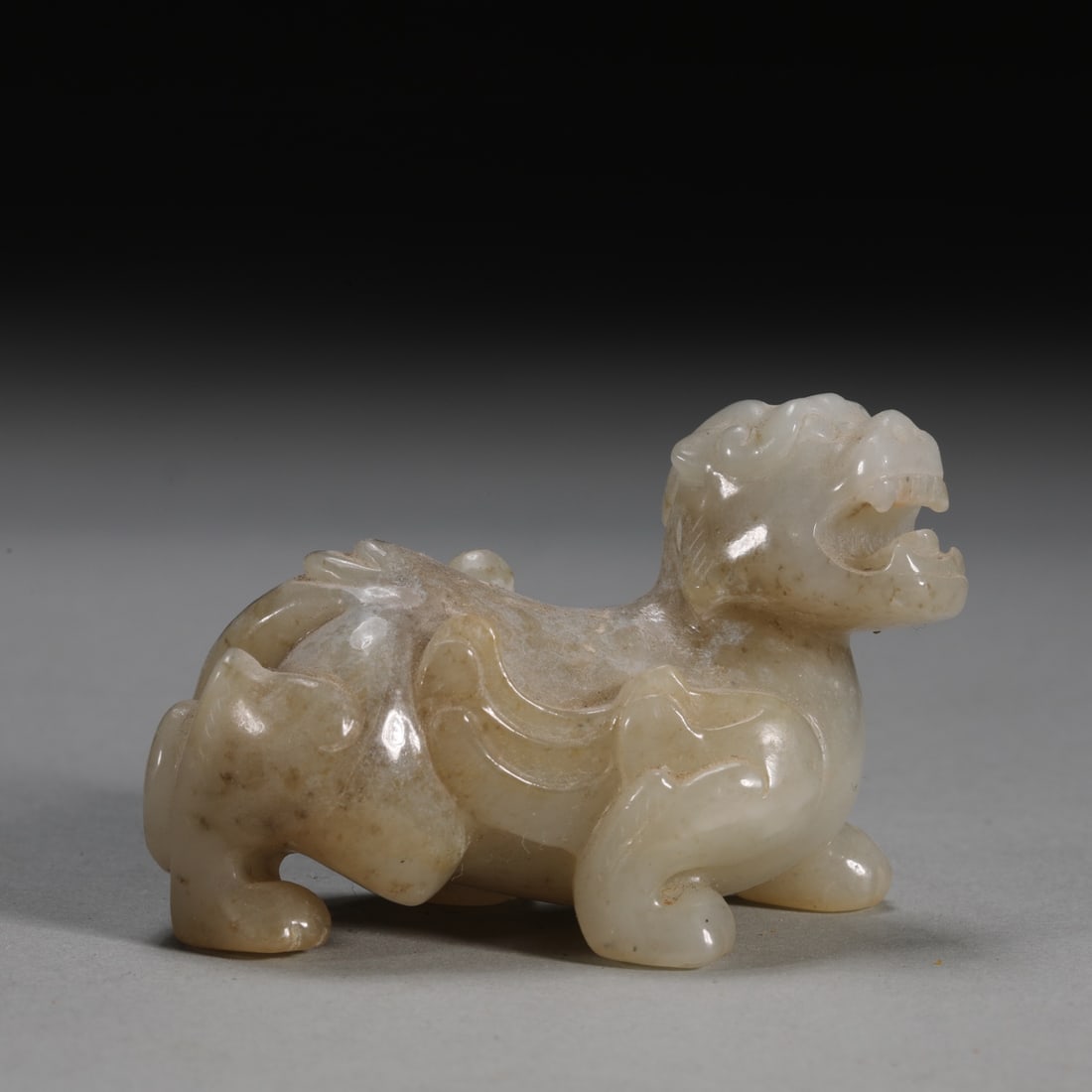A Han Dynasty Hetian white jade auspicious beast (1 of 7)