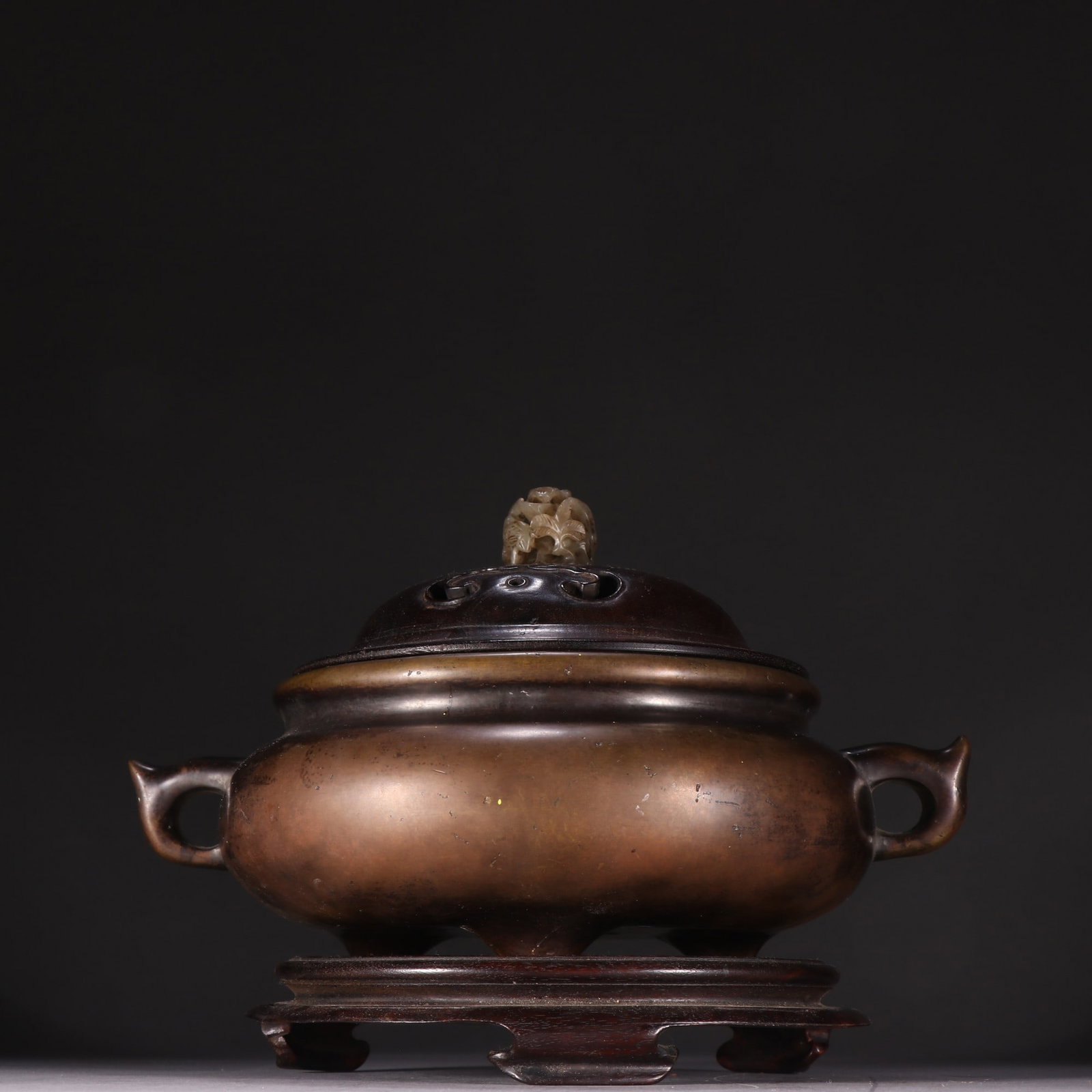 A Qing Dynasty bronze three-legged incense burner (1 of 9)