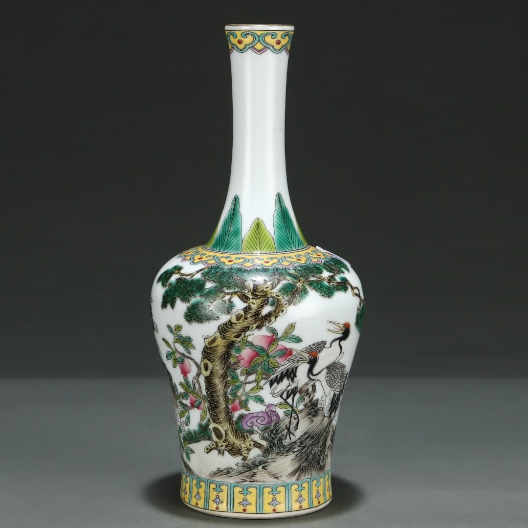 A Qing Dynasty Yongzheng period enamel pine crane longevity bell-shaking zun made during the: The enamel pine crane longevity bell-shaking zun made during the Yongzheng period of the Qing Dynasty Size: H: 23.3cm Belly diameter: 10.7cm Size: H: 23.3cm Belly diameter: 10.7cm (The Dimensions Of A