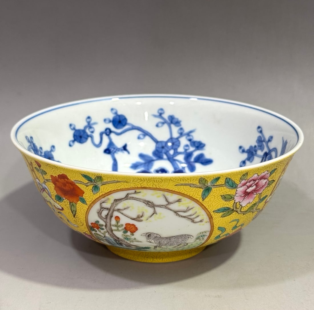 A Qing Dynasty Guangxu period bowl with a blue-and-white interior, a famille rose with windows and (1 of 9)