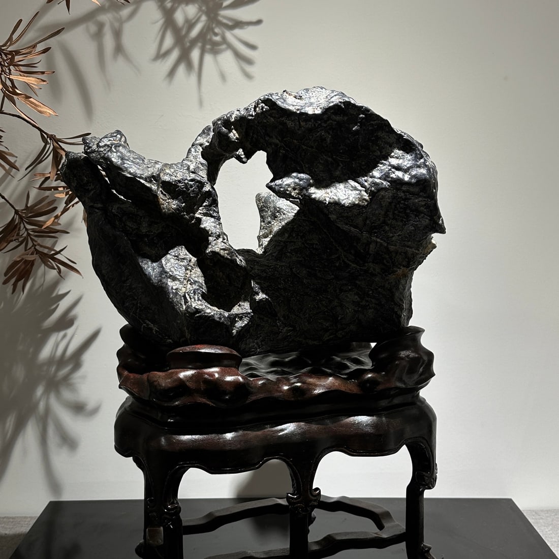A delicate Lingbi stone with a dragon embracing the moon (1 of 6)