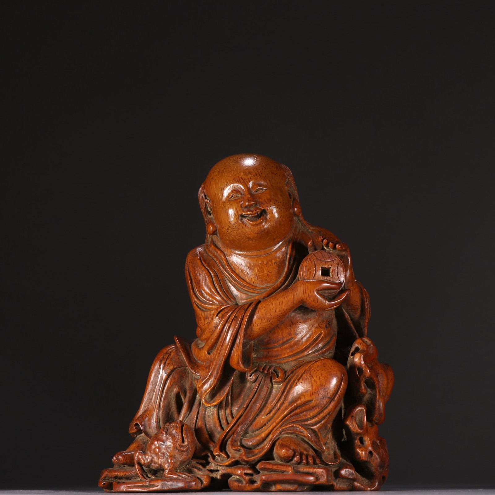 A Qing Dynasty bamboo-root Liu Hai statue playing with a golden toad (1 of 9)