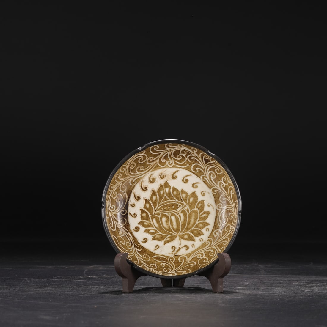 One is a large silver-mouthed basin washer from Song Dynasty Ding ware with brown carved lotus (1 of 7)
