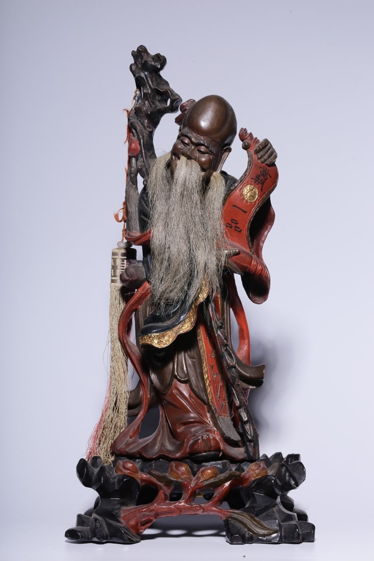 A wooden carving of the Longevity Star Lord from the Qing Dynasty, lacquered and colored, is old and: The Qing Dynasty wooden lacquered Shouxing statue is old and cracked Size: H: 35.5 cmL: 17 cmW:13.5 cm W:0.711 kg Size: H: 35.5 cmL: 17 cmW:13.5 cm W:0.711 kg (The Dimensions Of All Batches Are Manual