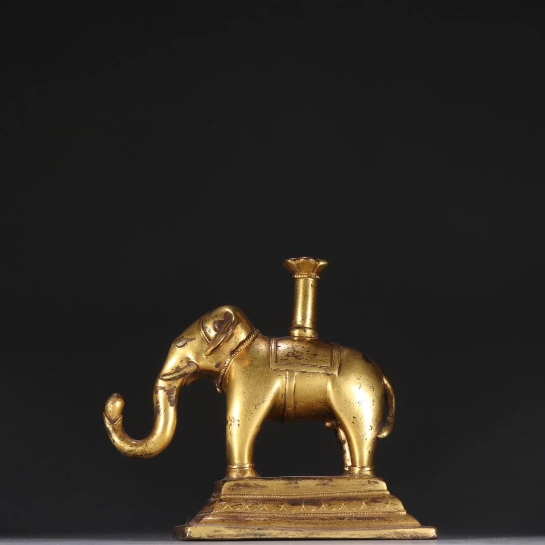 A finely crafted gilt bronze elephant offering lamp (1 of 9)