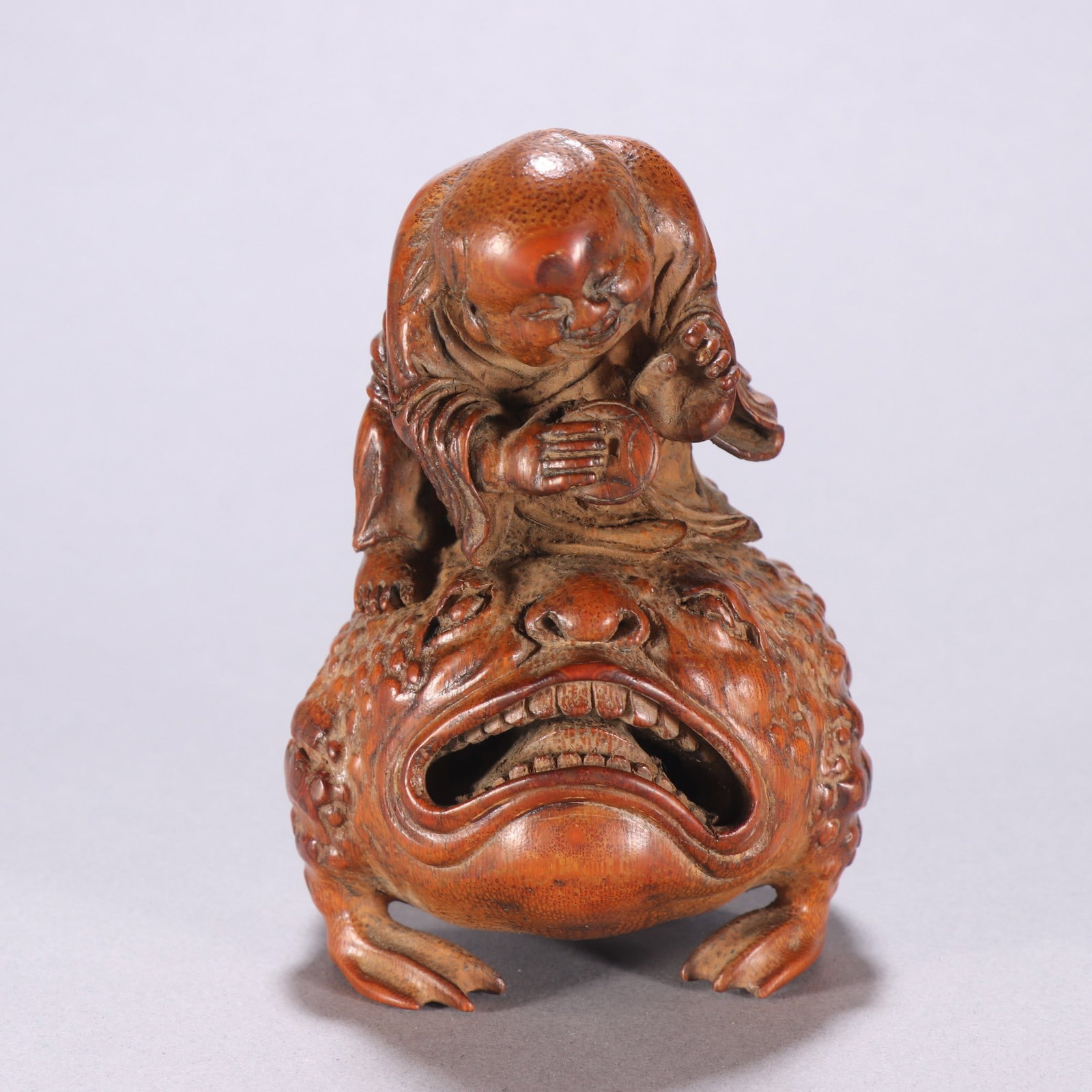 A Qing Dynasty bamboo carving of a Liu Hai playing with a golden toad (1 of 9)
