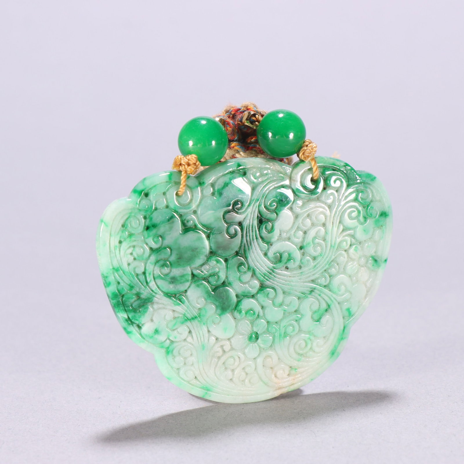 A Qing Dynasty jadeite floral pendant (1 of 9)