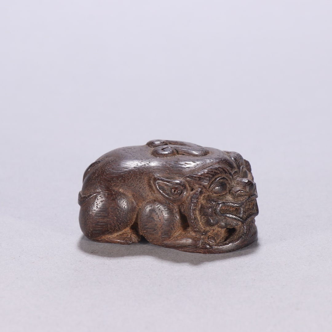 A Qing Dynasty agarwood Pixiu carving (1 of 9)