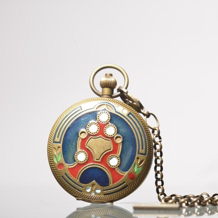 A beautifully crafted brass pocket watch inlaid with enamel floral patterns (1 of 9)