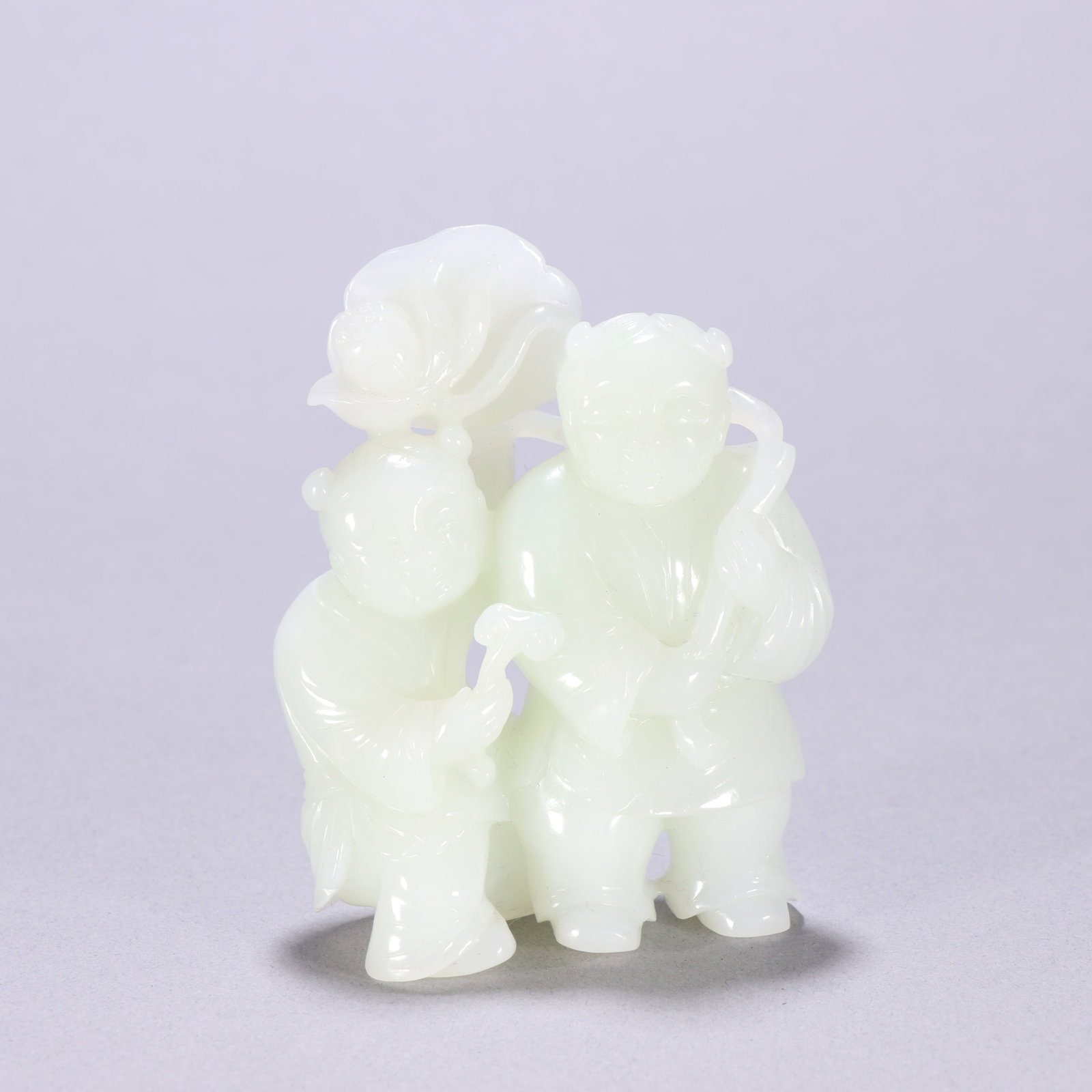 A Qing Dynasty Hetian jade carved piece of the Two Immortals of Hehe: A Qing Dynasty Hetian jade carved piece of the Combined Immortals Size: H: 8.5cm W: 6.7cm W: 0.2034 kg Size: H: 8.5cm W: 6.7cm W: 0.2034 kg (The Dimensions Of All Batches Are Manually Measured.If You 