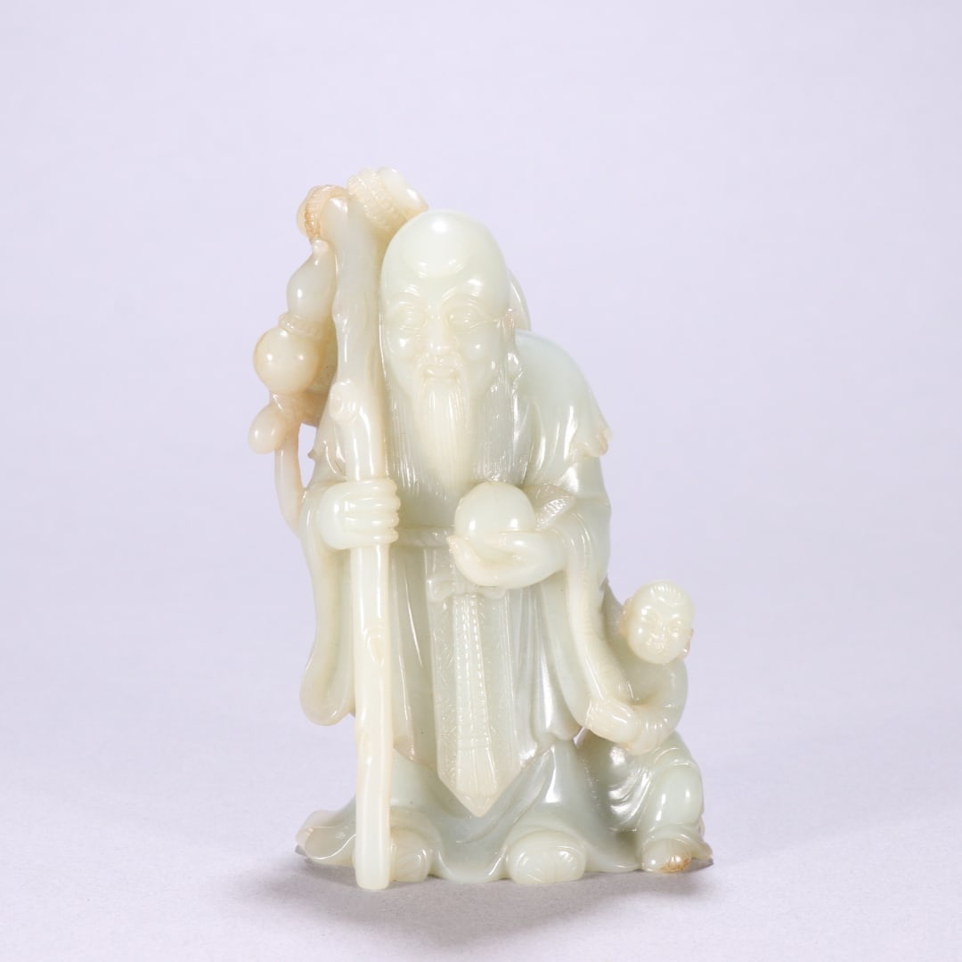 A Qing Dynasty Hetian jade longevity star carving (1 of 9)