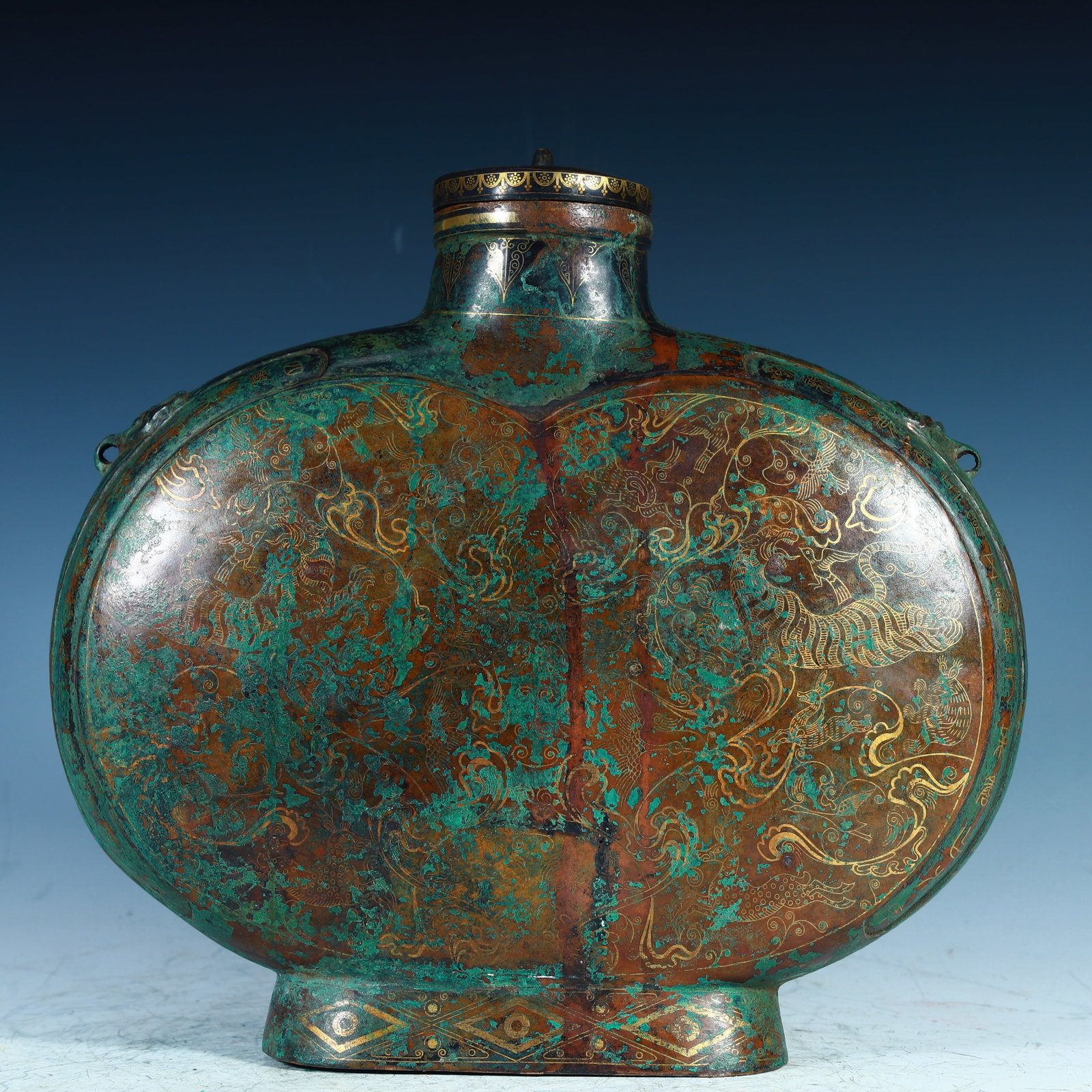A Han dynasty bronze inlaid flat teapot with gold and silver (1 of 12)