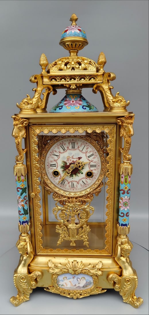 A beautifully carved gilded hand clock (1 of 9)