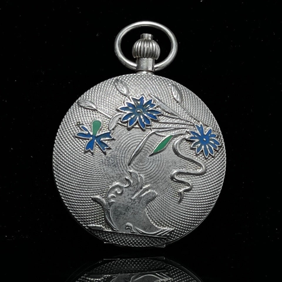 A beautiful pocket watch featuring sun, moon, and stars that double opening (1 of 5)