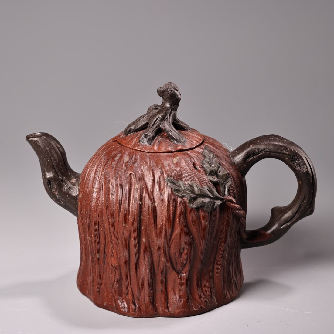 A finely crafted raw mineral red clay Yixing teapot (1 of 9)