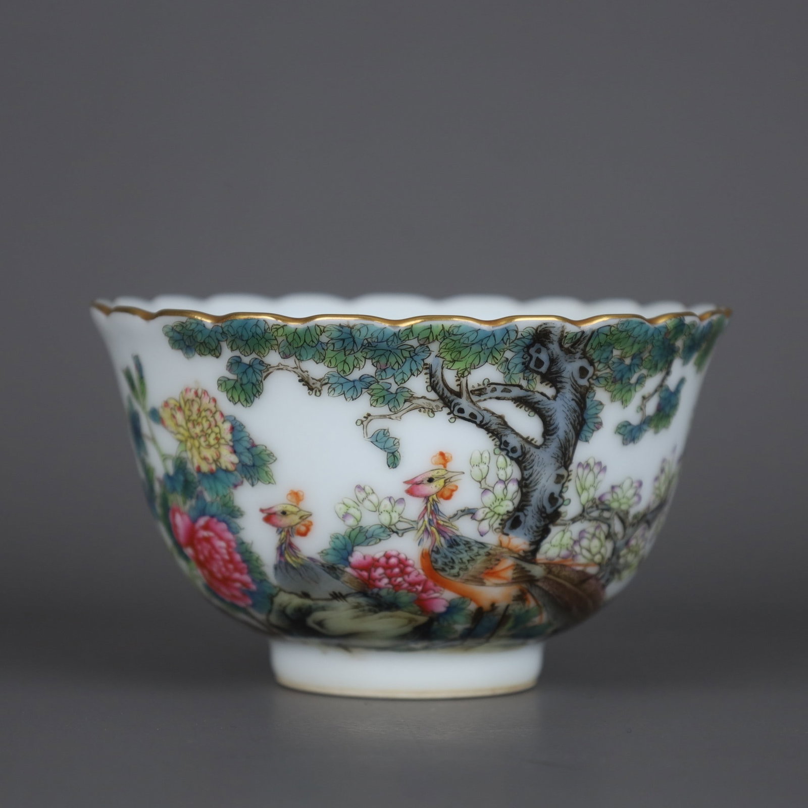 A bowl with a floral rim made during the Qianlong period of the Qing Dynasty, featuring enamel and (1 of 9)