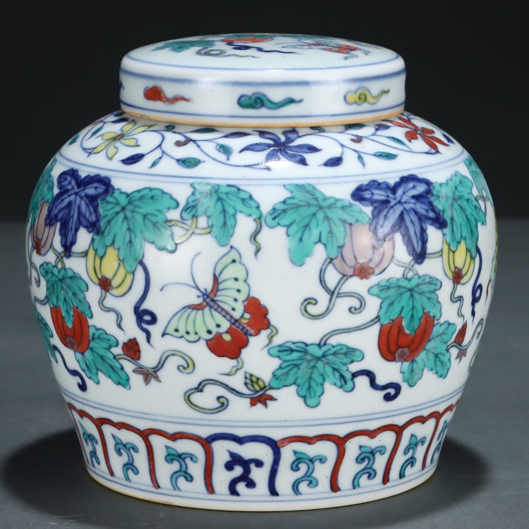 A Ming Dynasty Chenghua period jar with a doucai melon, fruit, butterfly, and sky-shaped jar (1 of 7)
