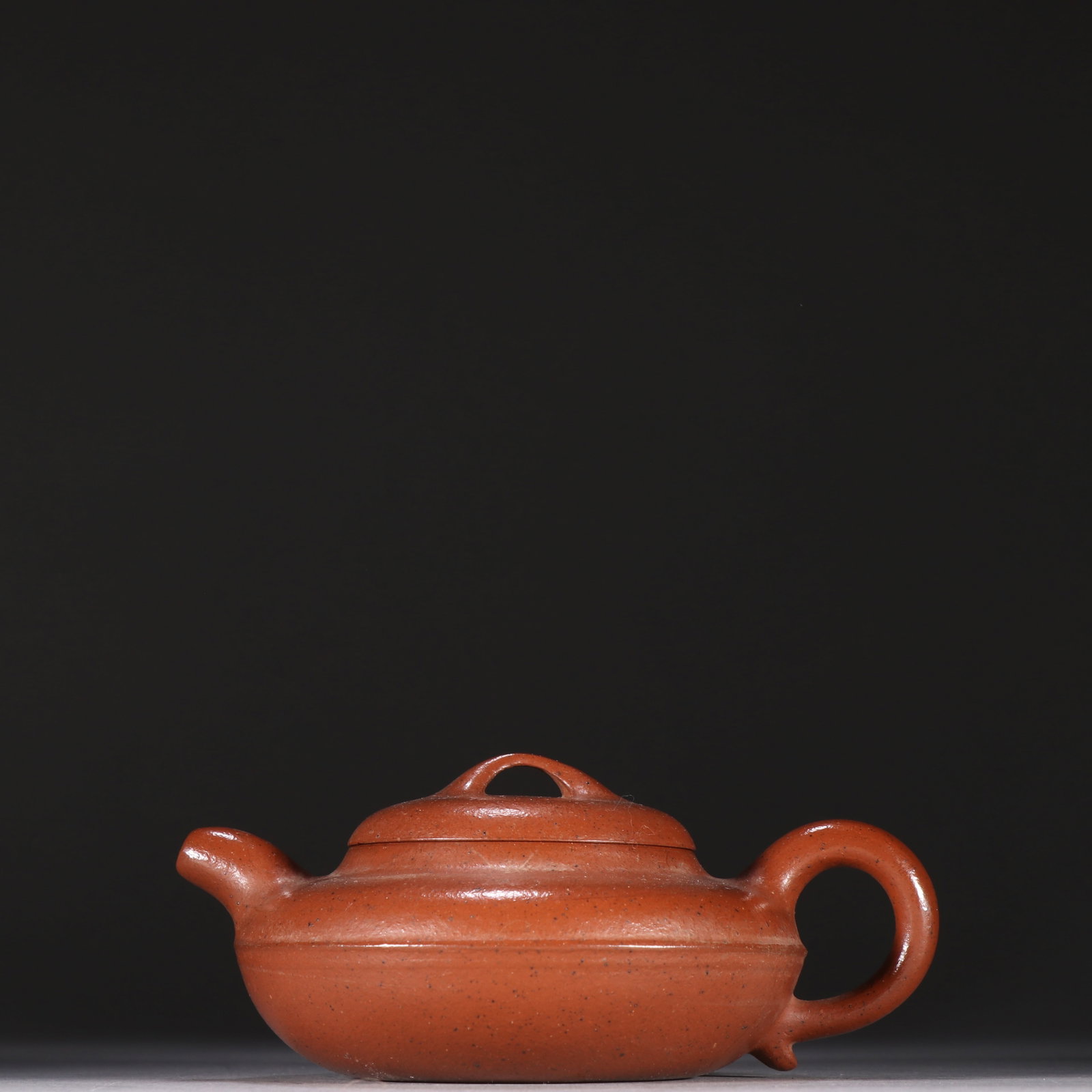 A Qing Dynasty Qingde Hall Zisha flat teapot (1 of 9)