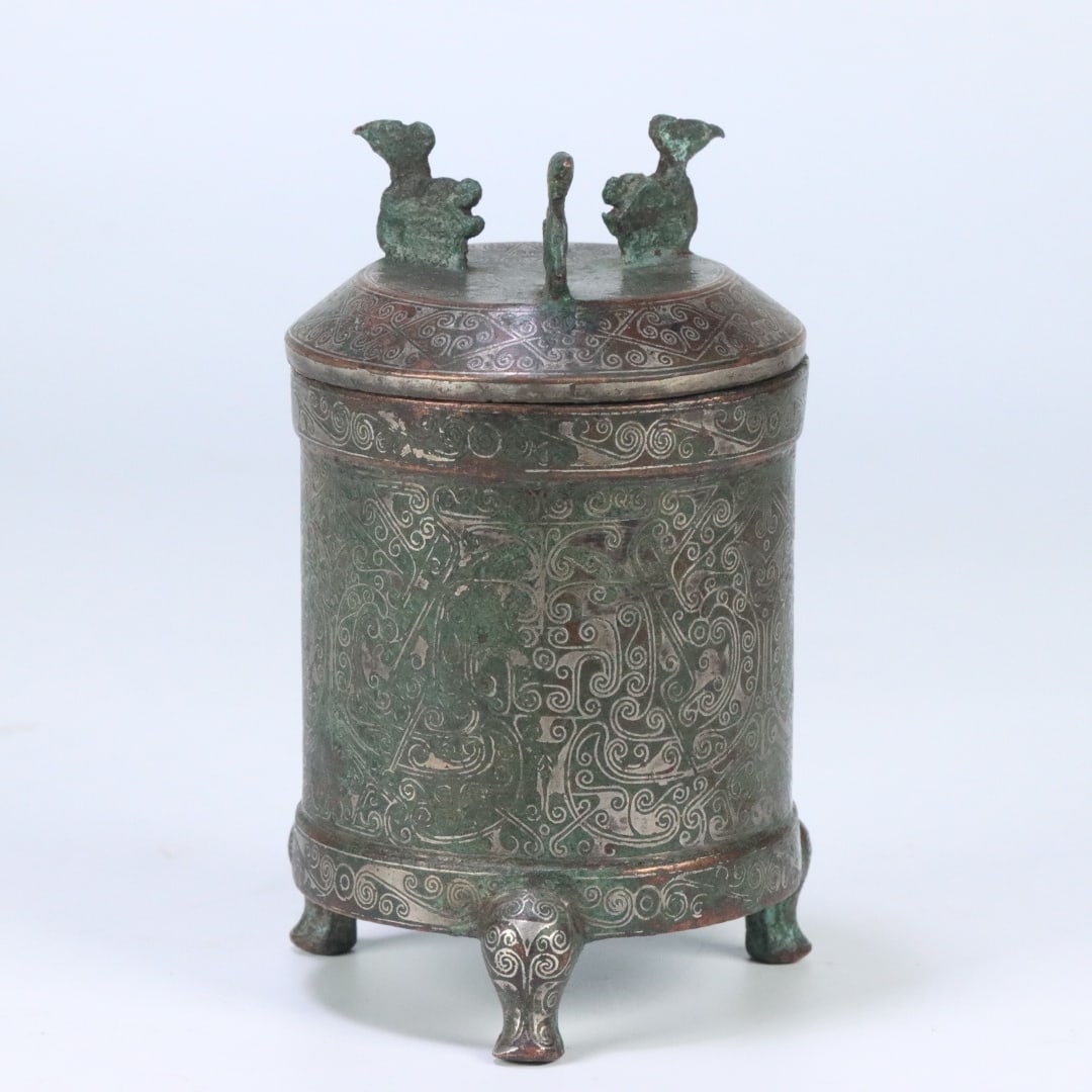 A Han dynasty bronze-inlaid gold-silver tripod warehouse: Han dynasty bronze inlaid with gold and silver three-legged warehouses Size:12.8x7.1x7.36cm W: 0.4077 kg Size:12.8x7.1x7.36cm W: 0.4077 kg (The Dimensions Of All Batches Are Manually Measured.If You N
