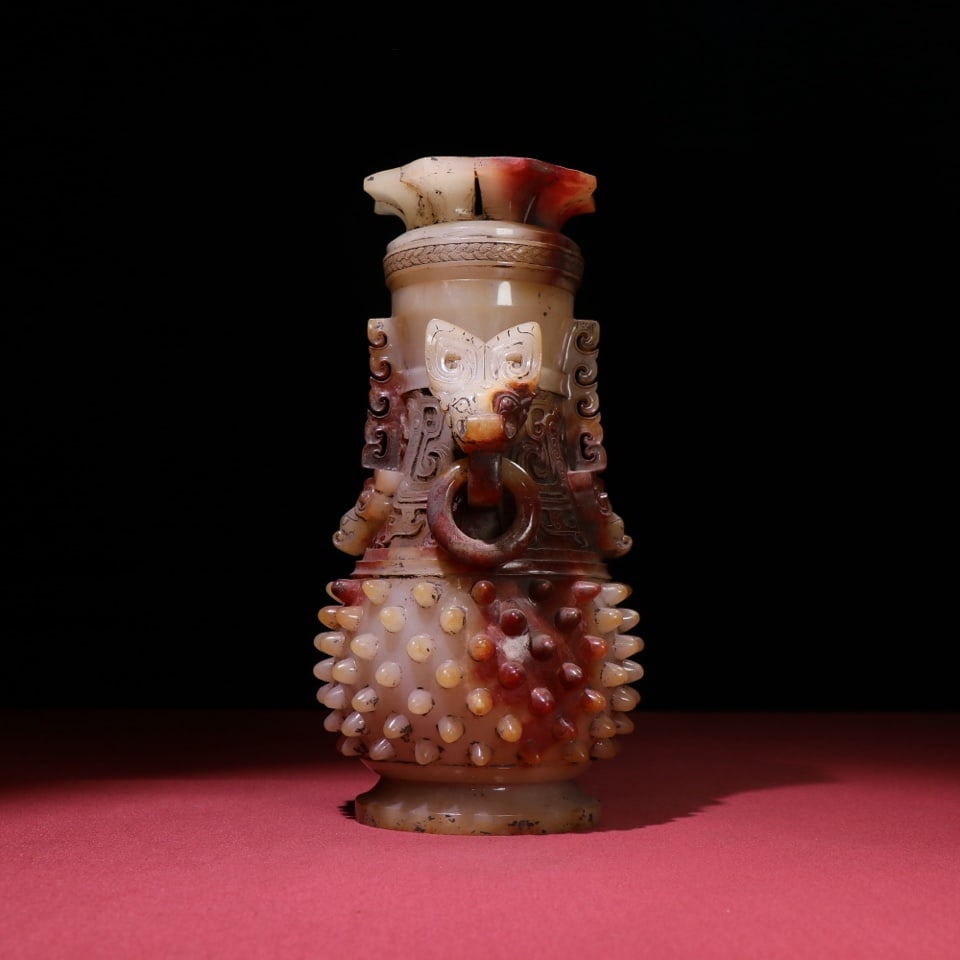 A finely crafted jade vase with earth-red and white jade with double-handled movable rings and black (1 of 8)