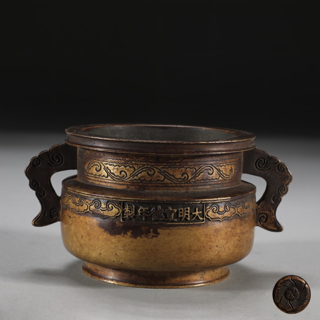 A Ming Dynasty finely cast bronze-bodied rolled-cloud ear gui-style censer (1 of 8)