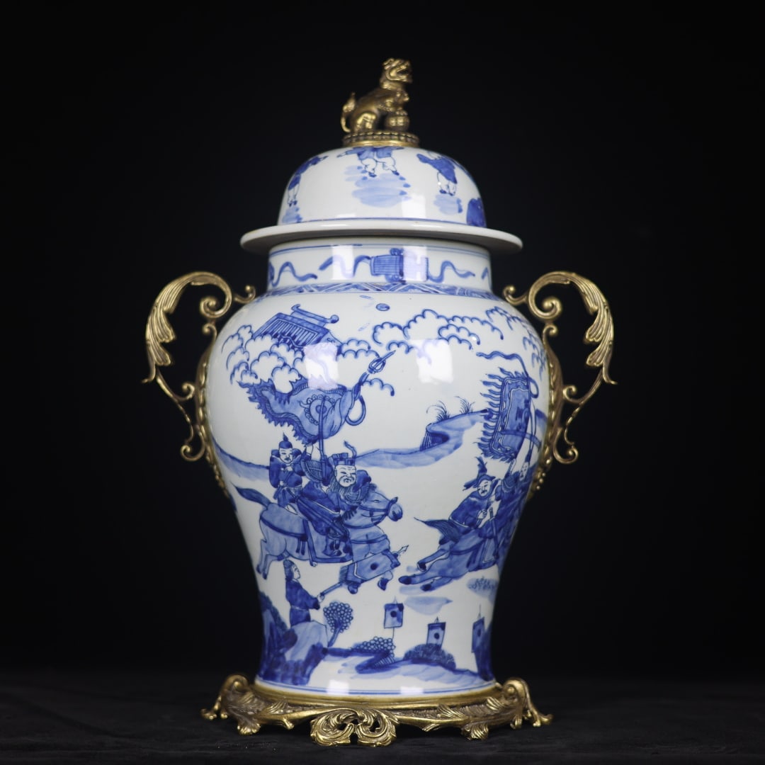 A fine blue-and-white general's jar with bronze floral border and story motifs: Exquisite blue-and-white general's jar with character story patterns inlaid with copper floral edges Size: H: 42cm Calibre: 13cm D:27cm Bottom:22cm Size: H: 42cm Calibre: 13cm D:27cm Bottom:22cm (The