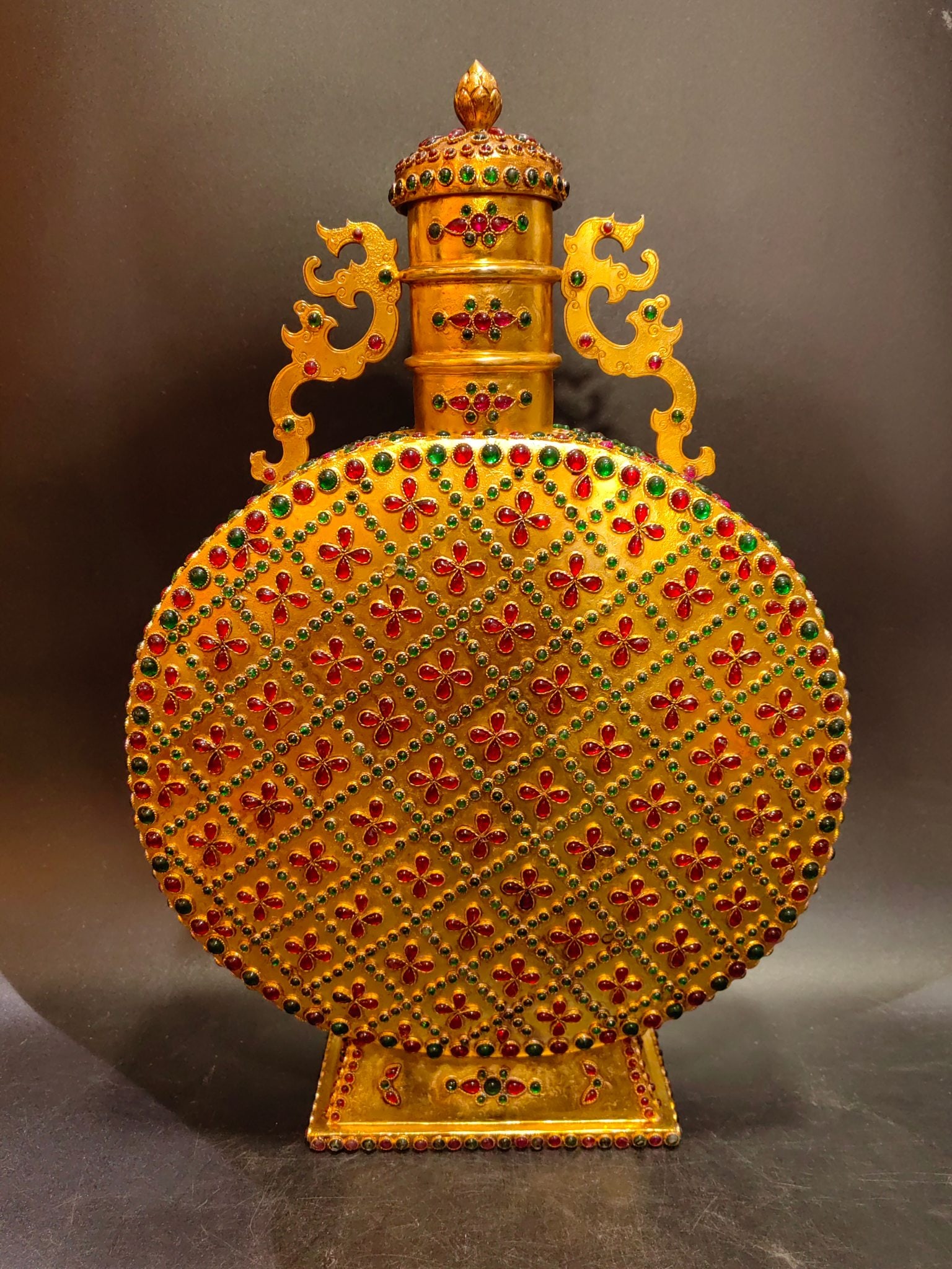 An Exquisite Gilt Bronze Inlaid Gems Double-Ears Vase: An Exquisite Gilt Bronze Inlaid Gems Double-Ears Vase Qing Dynasty, China Qianlong Four-character Mark Size:26.5cmx9cmx39cm Weight:3000g (The Dimensions Of All Batches Are Manually Measured.If You Nee