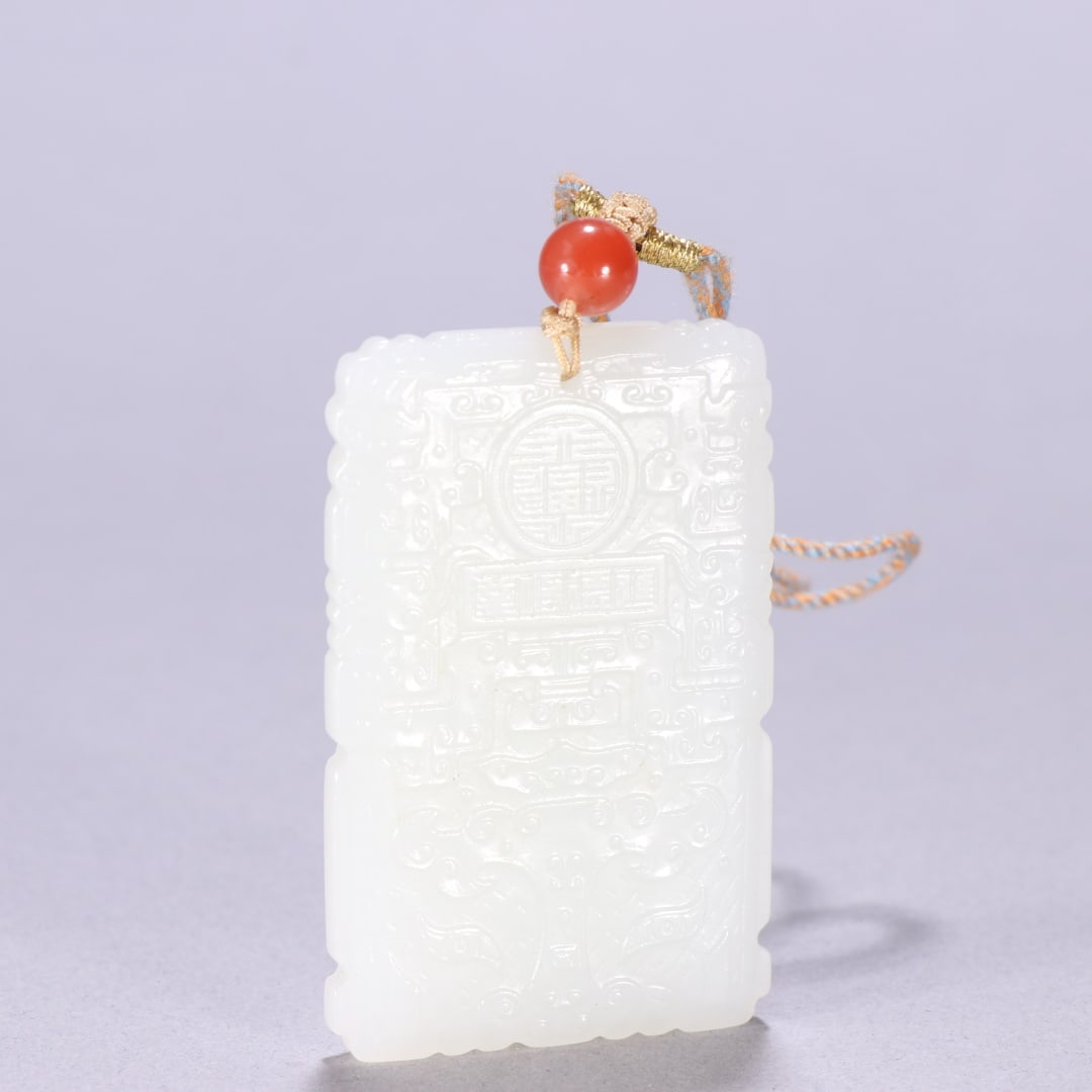 A Qing Dynasty Hetian jade taotie pattern hanging plaque: A Qing Dynasty Hetian jade taotie pattern plaque Size: H: 5.9cm W: 3.7cm W: 0.0389 kg (The Dimensions Of All Batches Are Manually Measured.If You Need More Detailed Information, Please Contact Our Cus