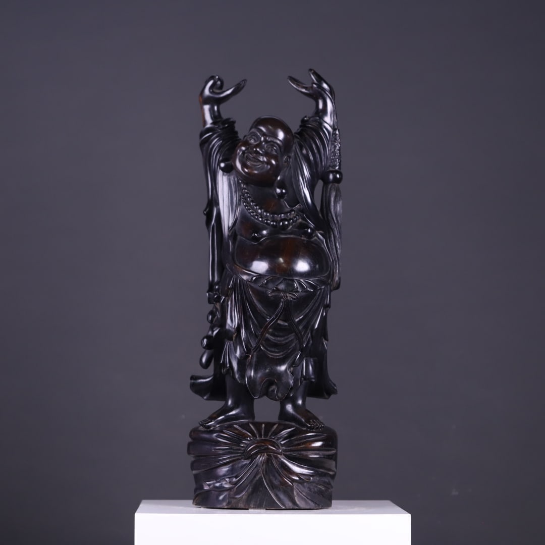 A Qing Dynasty rosewood standing statue of Maitreya Buddha holding both hands in the sky, inscribed: Qing Dynasty rosewood standing statue of Maitreya Buddha holding the sky with both hands, Jiachen mark Size: H: 67.5cmbottom: 22.5x16cm (The Dimensions Of All Batches Are Manually Measured.If You Need