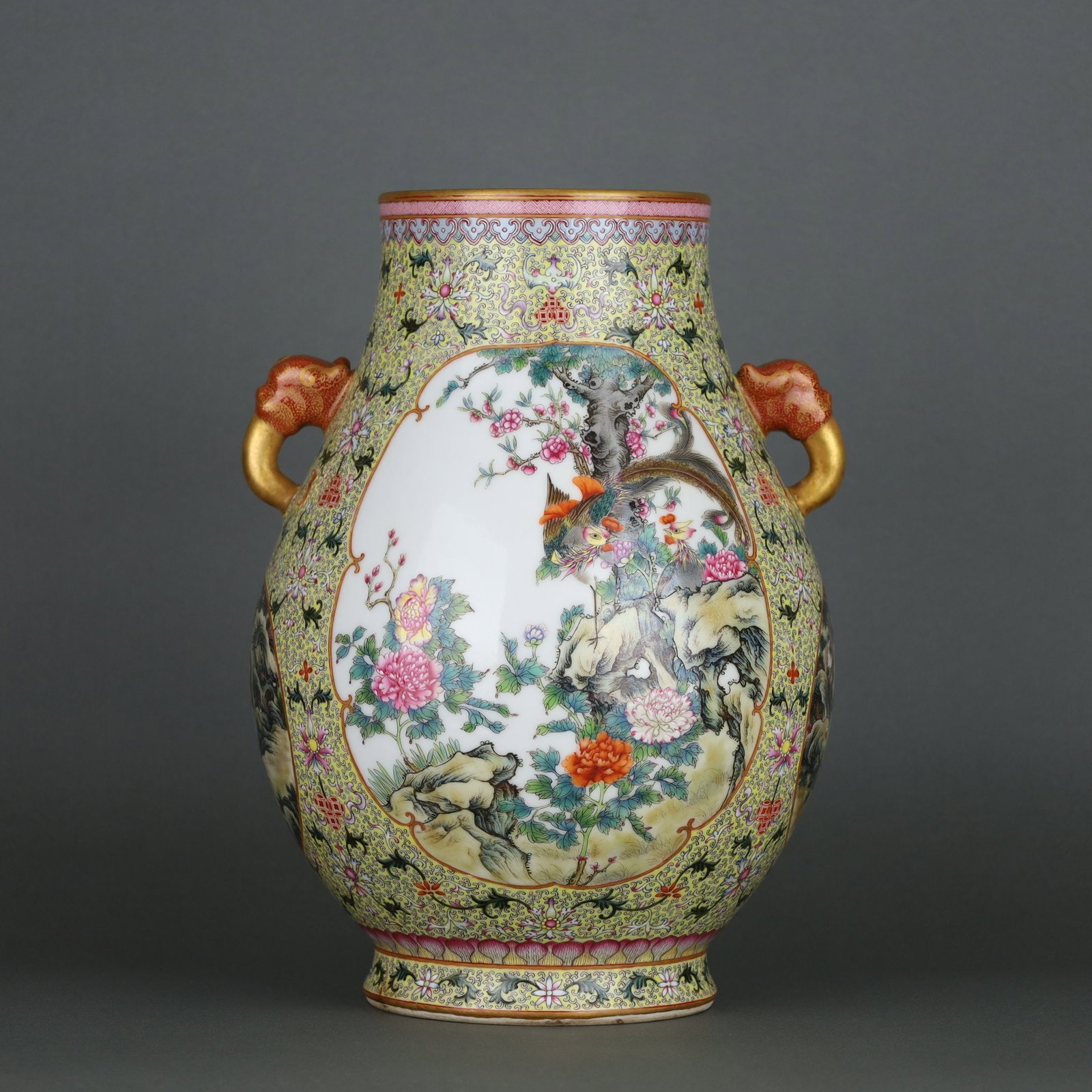 A yellow-ground famille rose window flower and bird beast-ear zun with a Qianlong period from the: A yellow-ground famille rose window vessel with animal ears and bird motifs, made during the Qianlong period of the Qing Dynasty Size: H:31.5cm Belly diameter: 24cm (The Dimensions Of All Batches Are 