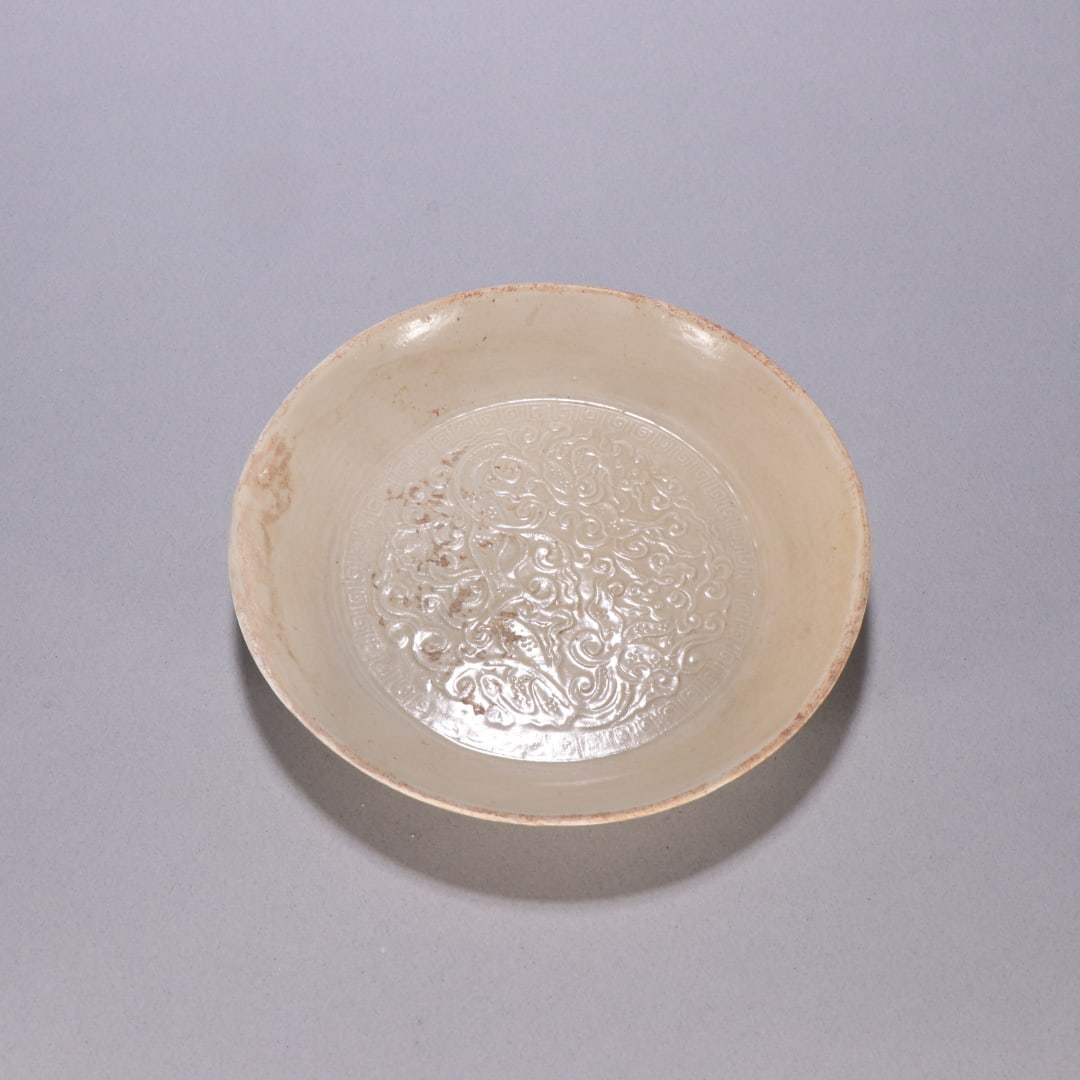 A plate from the Song Dynasty Ding kiln: Ding ware plate from the Song Dynasty Size: H: 2.2cm W: 14.7cm (The Dimensions Of All Batches Are Manually Measured.If You Need More Detailed Information, Please Contact Our Customer Service Before Bi