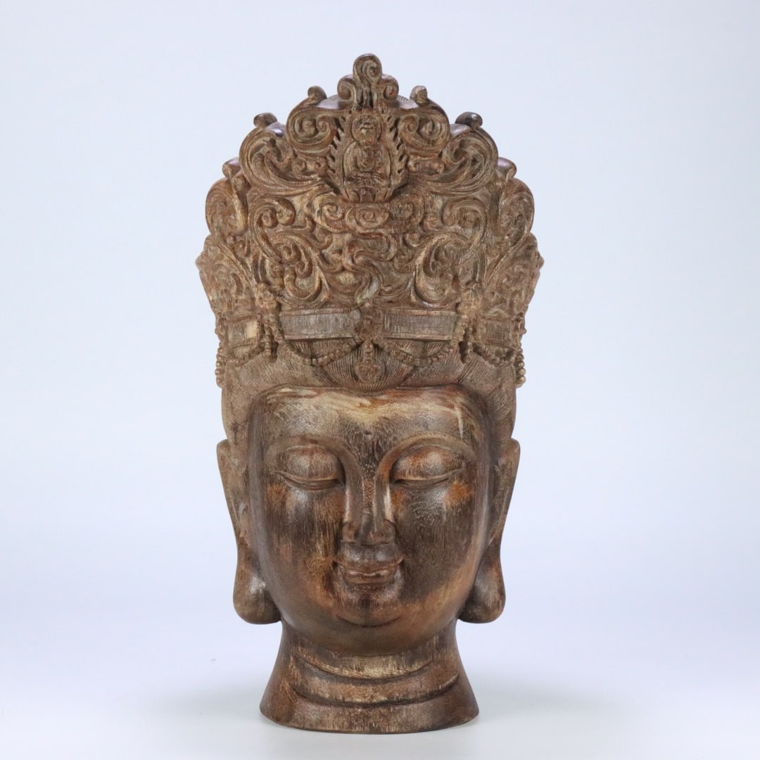 A finely crafted oversized ancient agarwood Buddha head carving of Qinan: Exquisite oversized ancient agarwood Buddha head carving of Qinan Size:40.5x52.4x20.7 cm W: 6.355 kg (The Dimensions Of All Batches Are Manually Measured.If You Need More Detailed Information, Please 