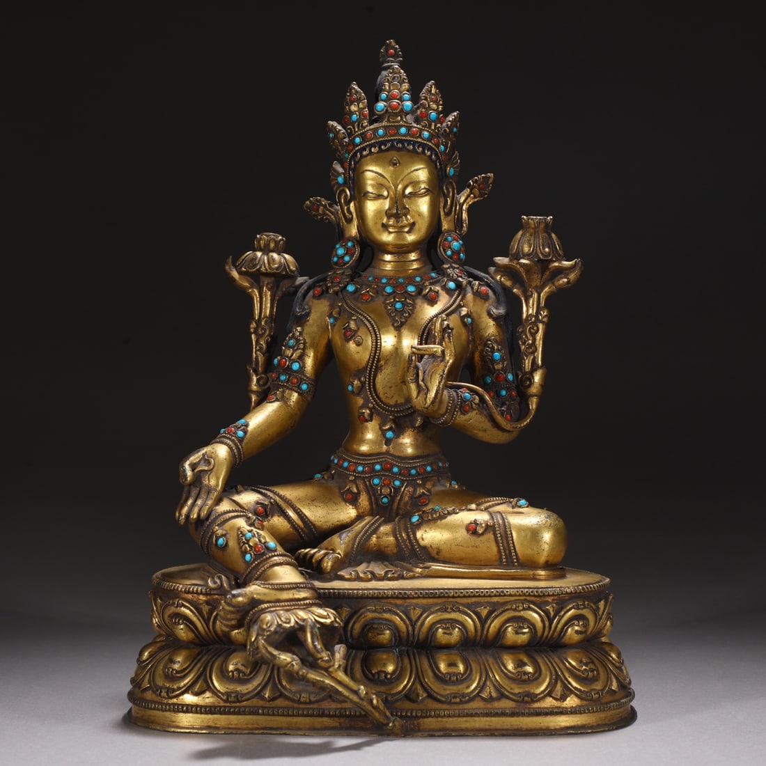 A Ming Dynasty finely cast gilded green seated statue of Tara with a bronze body: A finely cast gilded green seated Tara statue with a bronze body from the Ming Dynasty Size: H:28.5cm W:20cm W: 4.35 kg (The Dimensions Of All Batches Are Manually Measured.If You Need More Detailed I