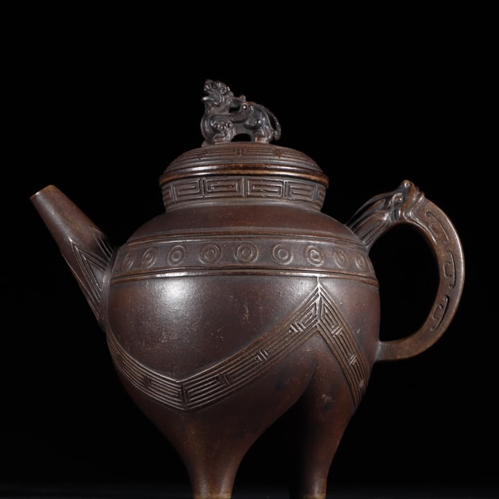 A Ming Dynasty Xu Youquan Zisha teapot with a beast-knob imitation of bronze he (1 of 10)