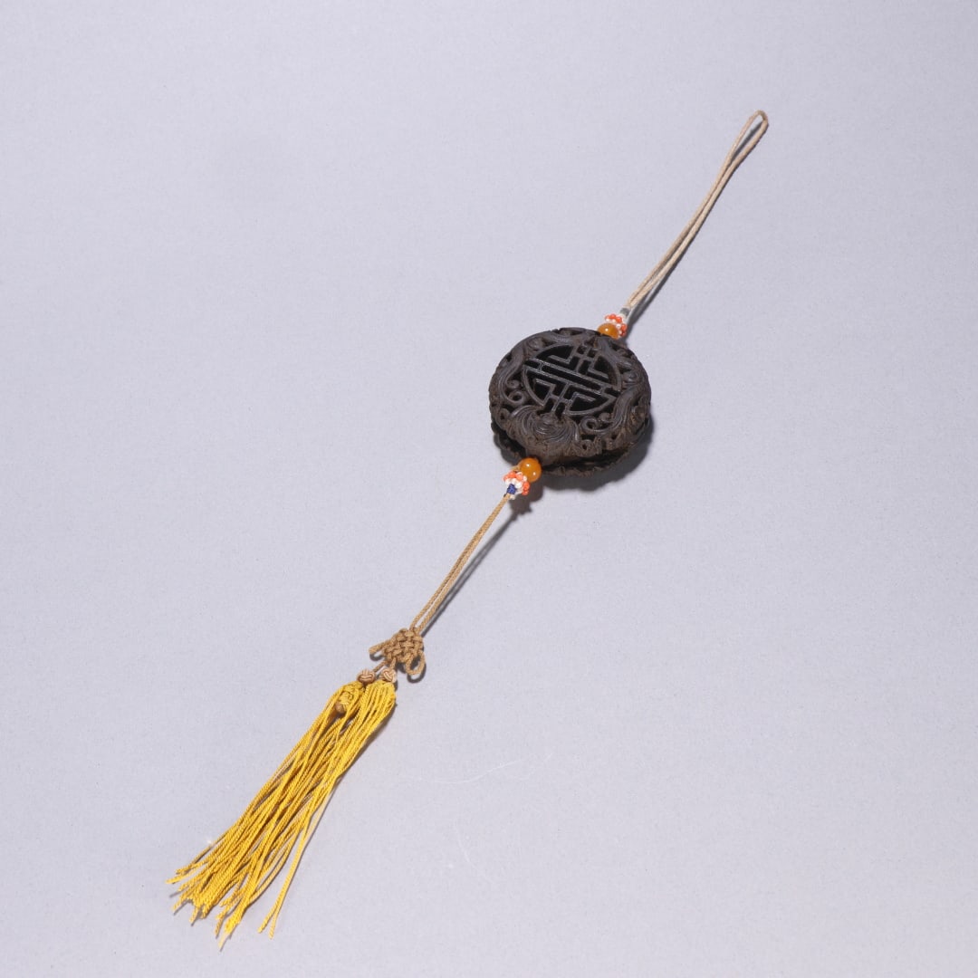 A Qing Dynasty agarwood cluster longevity pattern sachet pendant (1 of 9)
